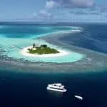 over reef private maldives surf charter boat floating villa