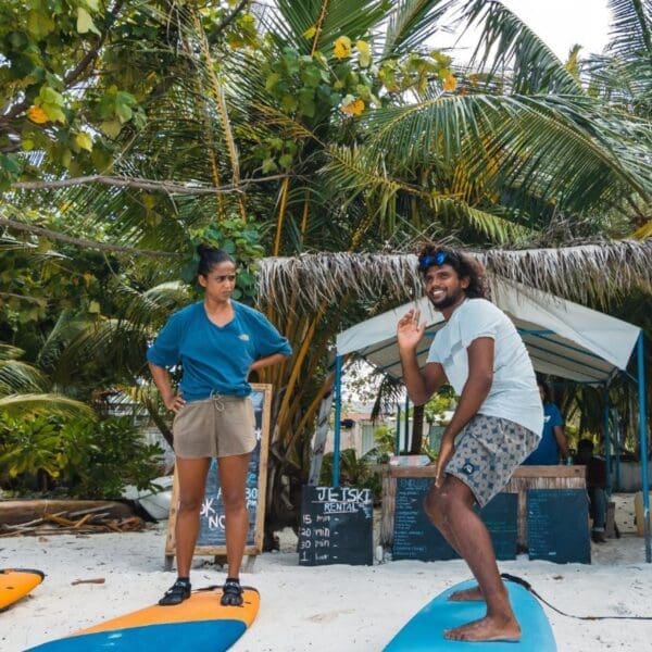 learn to surf in the maldives thulusdhoo surf camp lessons stoked surf adventures akiri surf 2