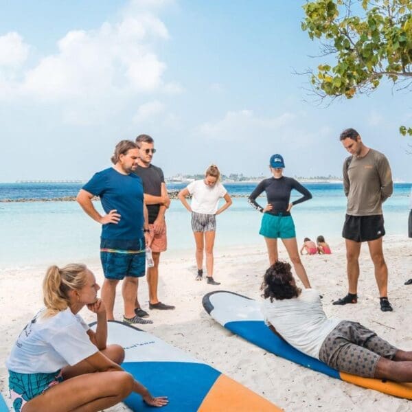 learn to surf in the maldives thulusdhoo surf camp lessons stoked surf adventures akiri surf 2