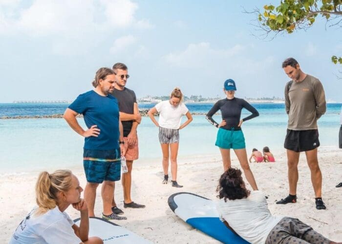 learn to surf in the maldives thulusdhoo surf camp lessons stoked surf adventures akiri surf 2